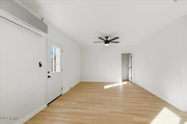 a view of a room with wooden floor