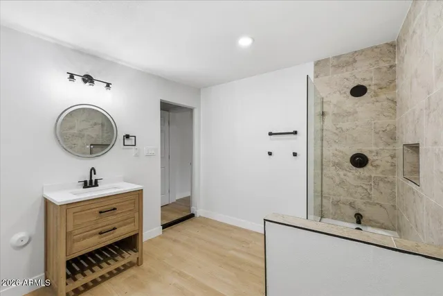 an empty room with a window and a ceiling fan