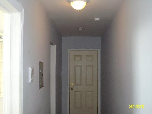 5203 South Calumet Avenue, Unit 3D Chicago, IL 60615 - Photo 5 of 8 a bathroom with a light fixture and a sink
