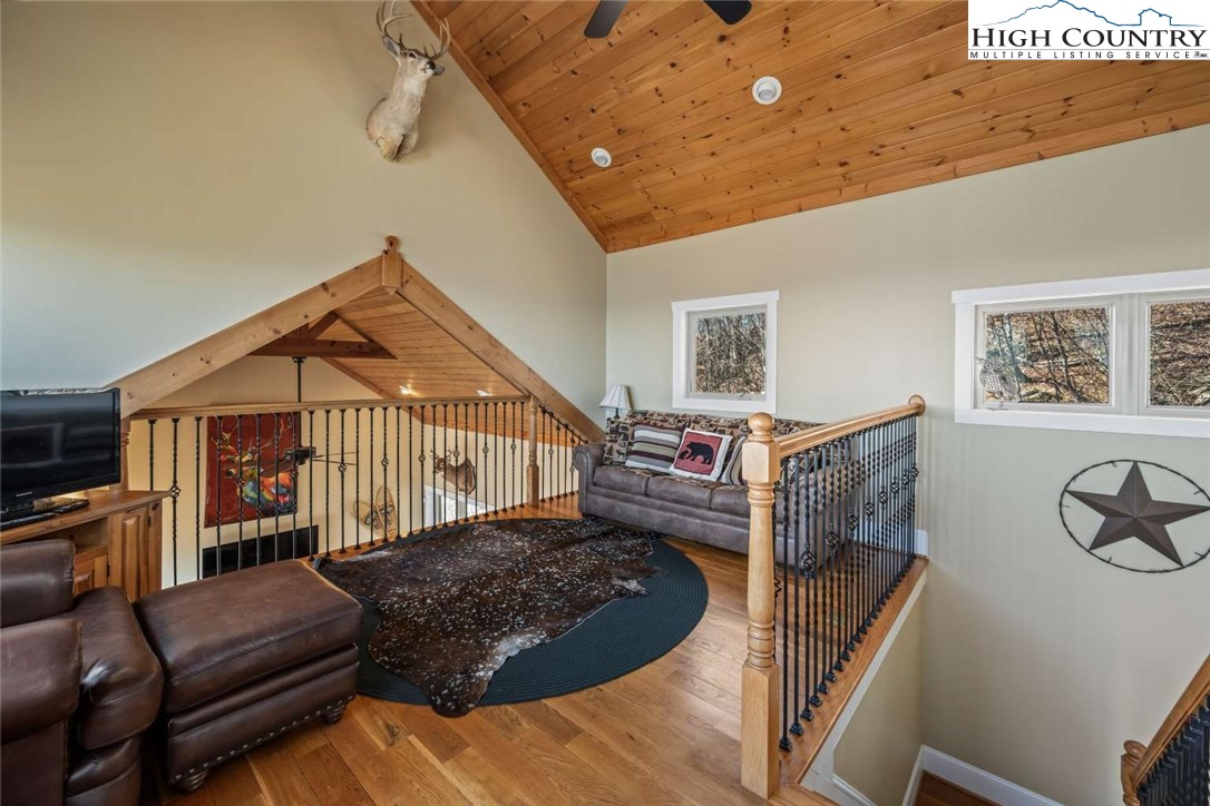 585 Stony Fork Road West Jefferson, NC 28694 - Photo 20 of 25 a living room with furniture a couch and dresser with wooden floor
