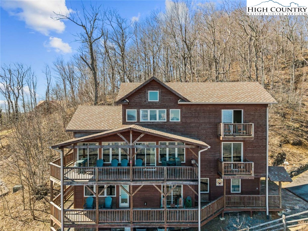 585 Stony Fork Road West Jefferson, NC 28694 - Photo 2 of 25 a front view of a house with balcony