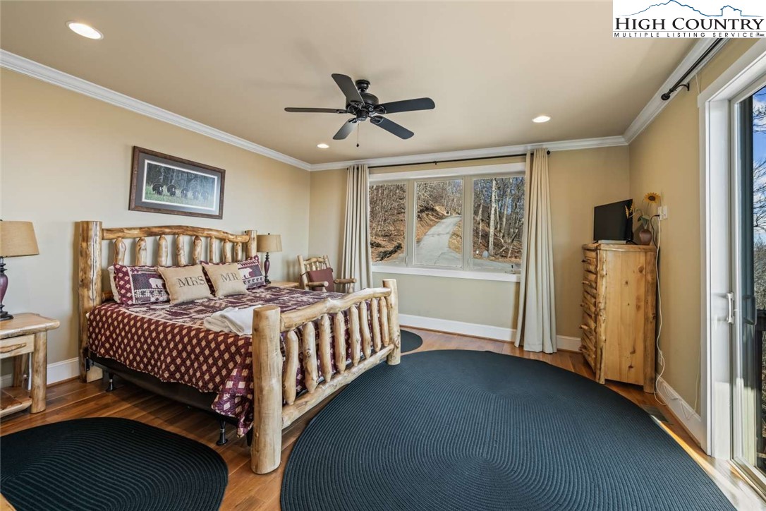 585 Stony Fork Road West Jefferson, NC 28694 - Photo 22 of 25 a bedroom with furniture and windows