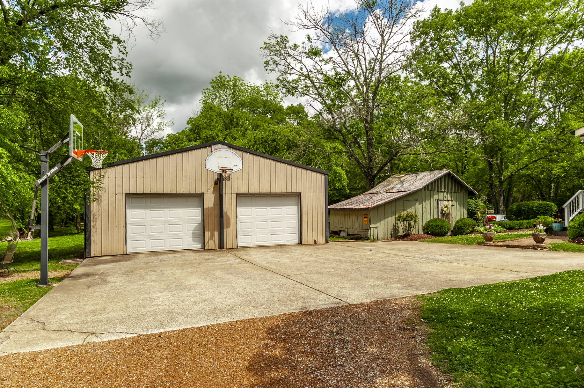 7255 Lebanon Road Lebanon, TN 37087 - Photo 13 of 55 a front view of a house with a yard and garage