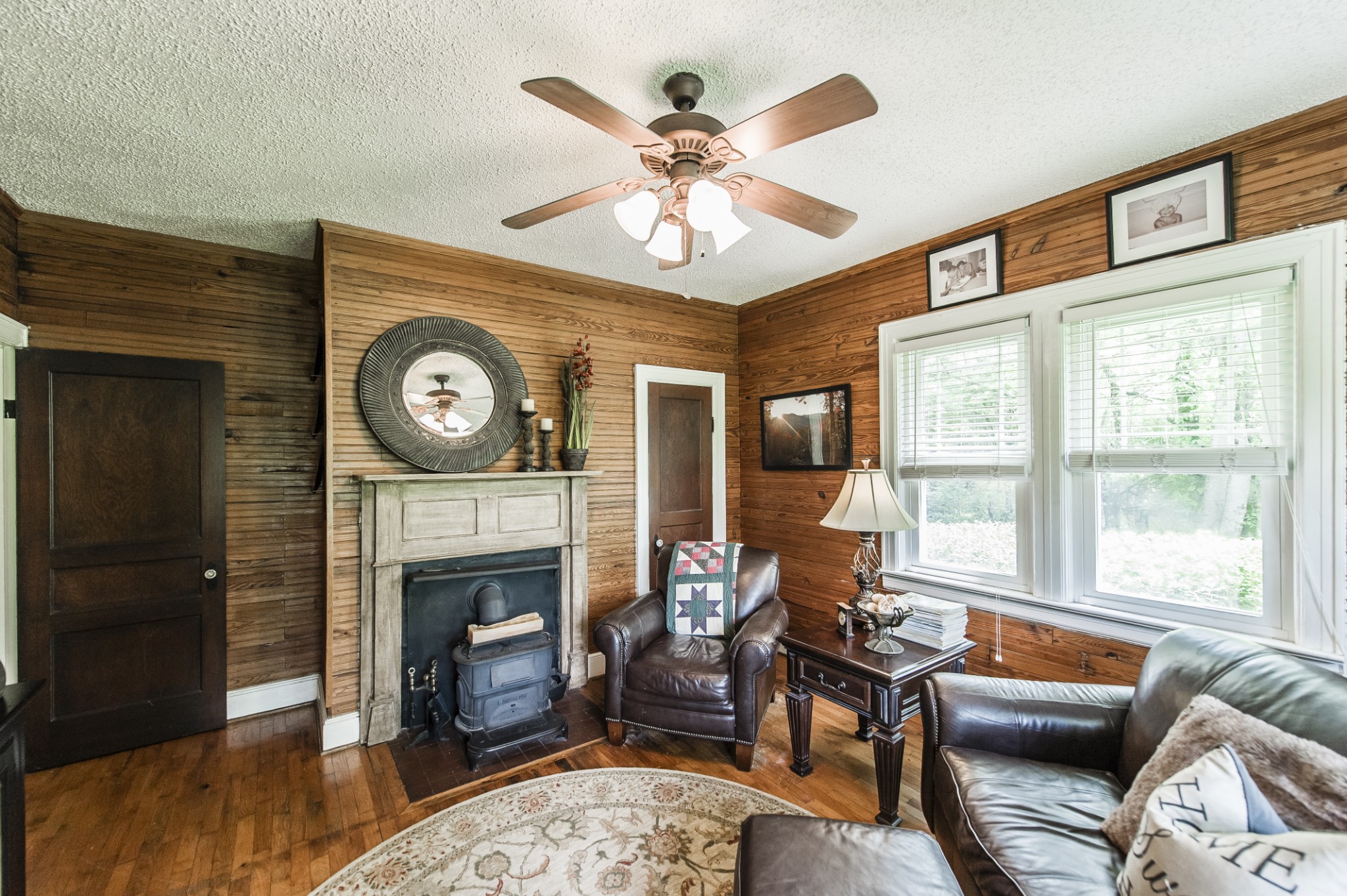 7255 Lebanon Road Lebanon, TN 37087 - Photo 43 of 55 a living room with furniture a clock and a fireplace