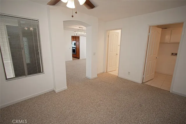 an empty room that has a window in it