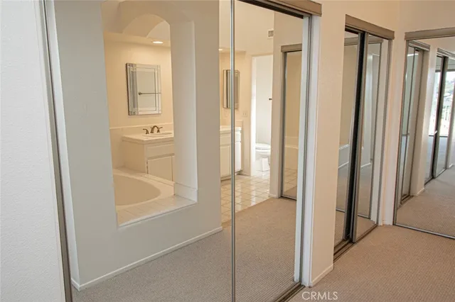 a view of a bathroom from a hallway
