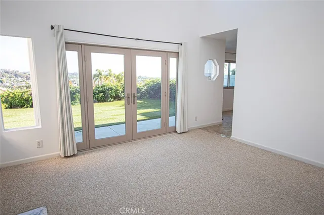 a view of a room with windows and closet