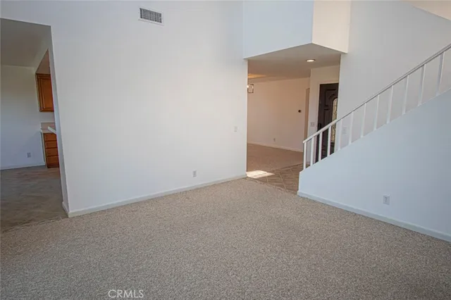 a view of a hallway with staircase