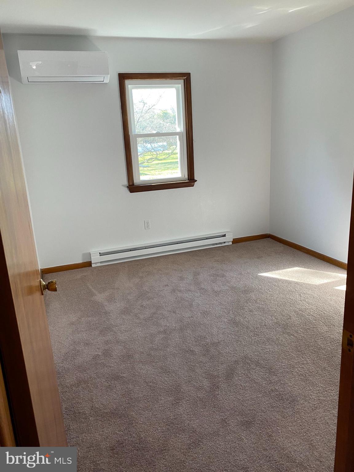25539 Thomas Street Milton, DE 19968 - Photo 22 of 24 ductless mini-split system on wall near ceiling