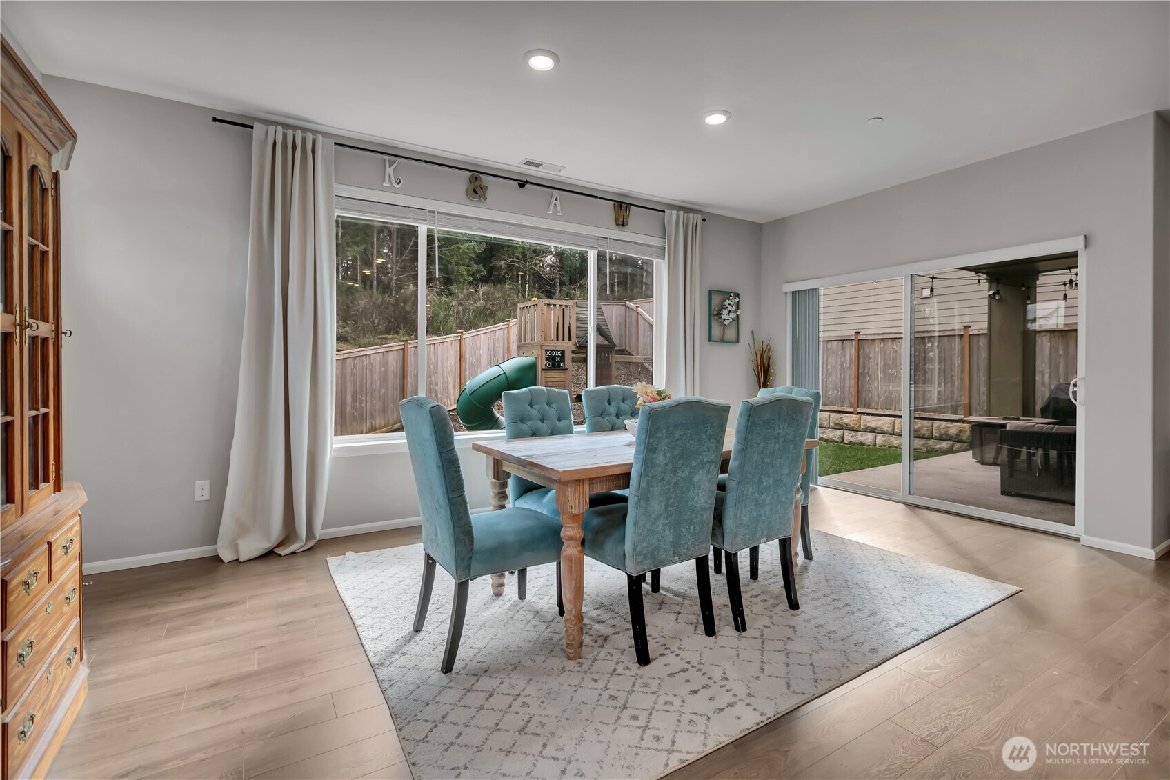 1226 Baker Hts Loop Bremerton, WA 98312 - Photo 11 of 40 a view of a dining room with furniture window and wooden floor