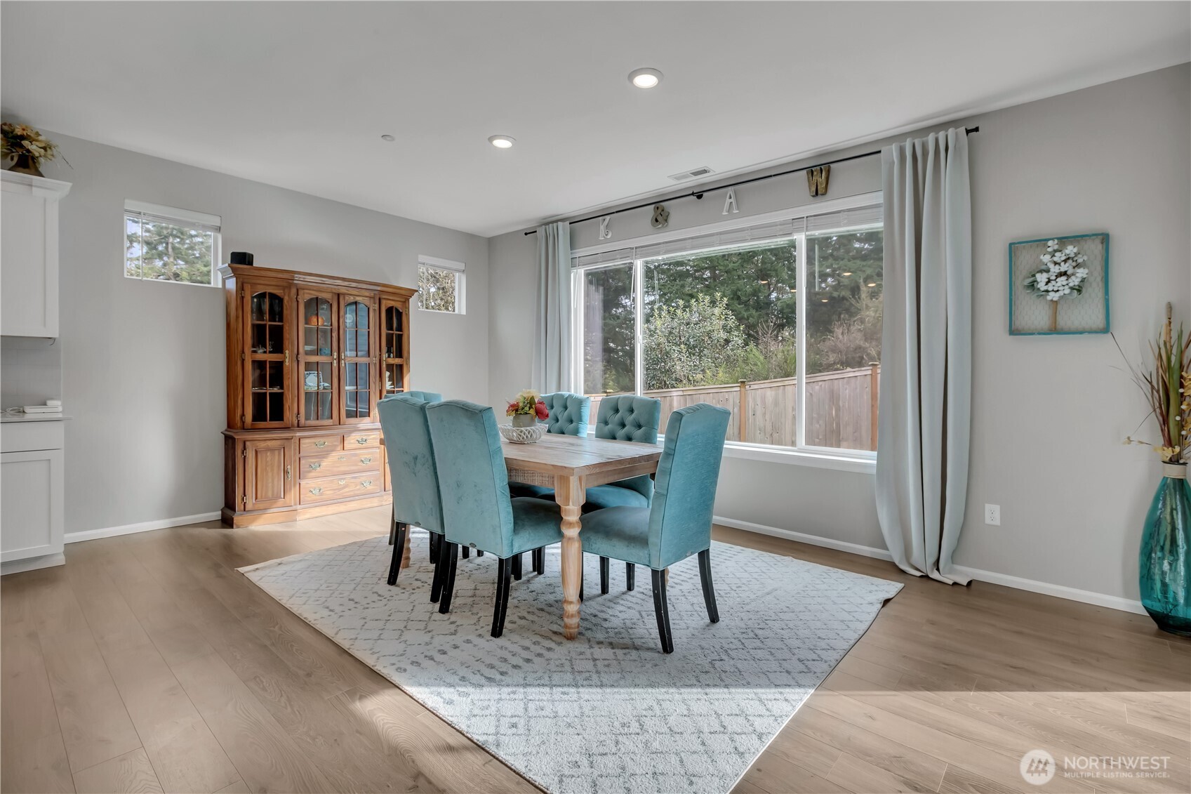 1226 Baker Hts Loop Bremerton, WA 98312 - Photo 12 of 40 a view of a dining room with furniture window and wooden floor