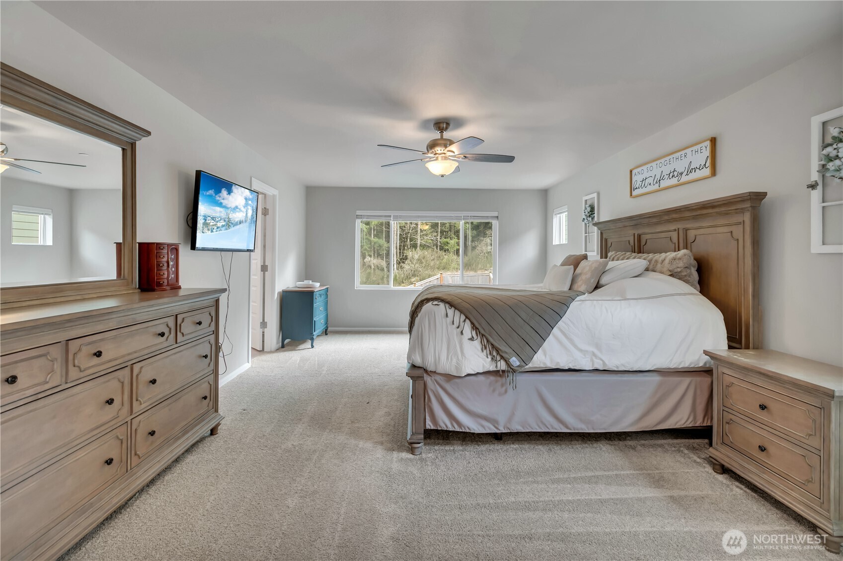 1226 Baker Hts Loop Bremerton, WA 98312 - Photo 23 of 40 a bedroom with a large bed and a dresser