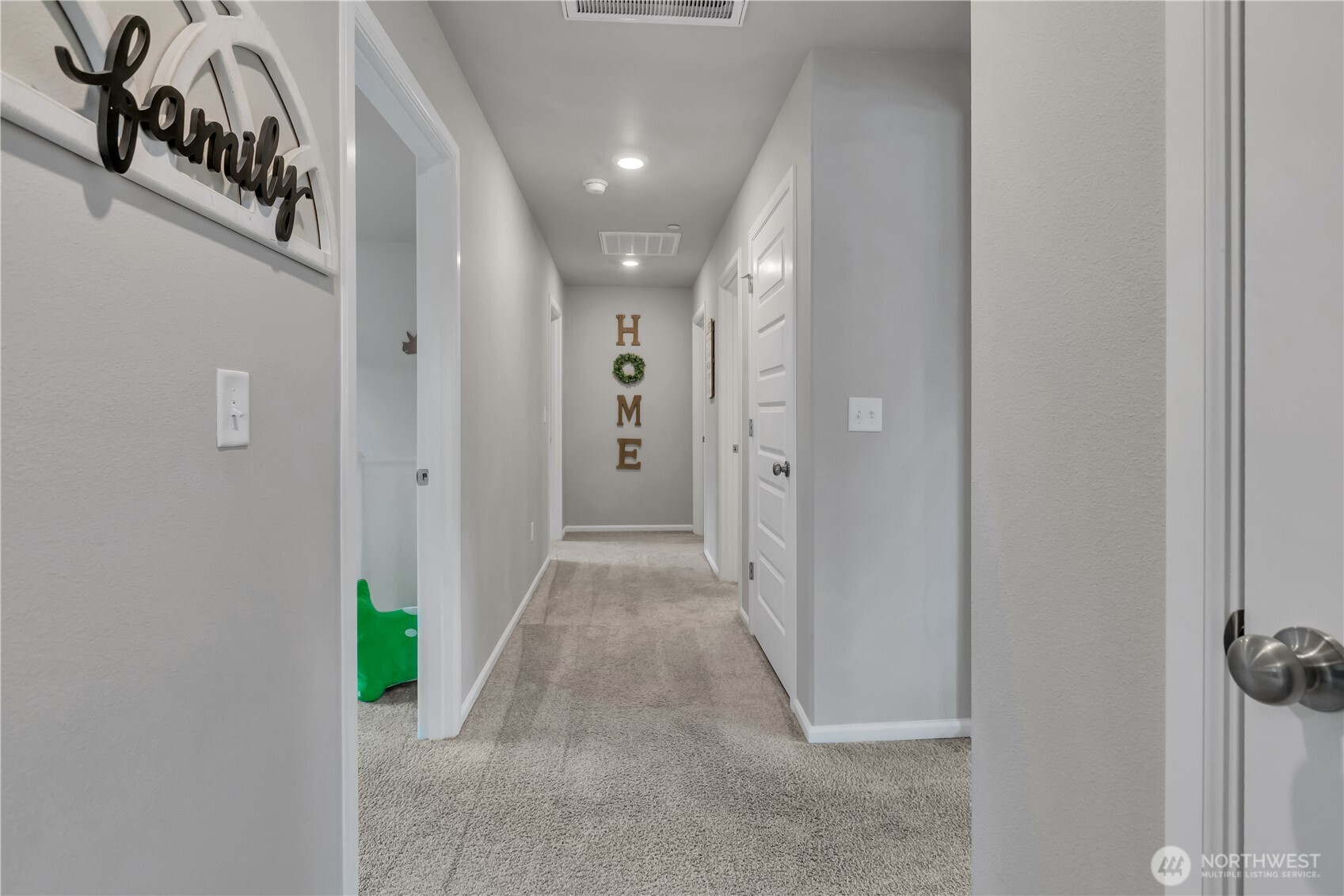 1226 Baker Hts Loop Bremerton, WA 98312 - Photo 29 of 40 a view of a hallway with a dining area