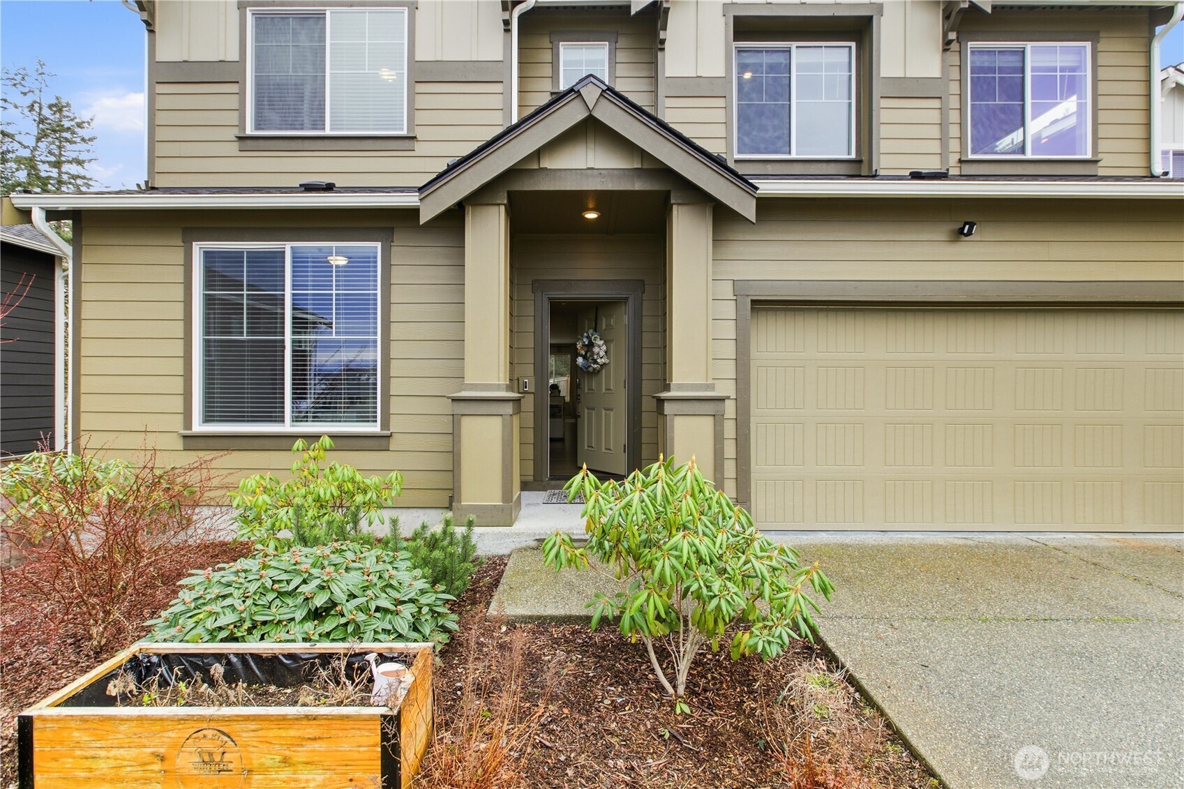 1226 Baker Hts Loop Bremerton, WA 98312 - Photo 3 of 40 a house view with a garden space