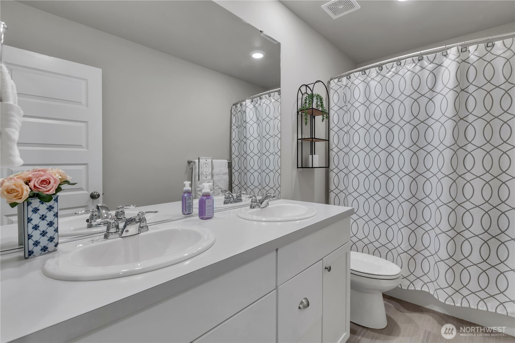 1226 Baker Hts Loop Bremerton, WA 98312 - Photo 31 of 40 a bathroom with a double vanity sink toilet and a mirror