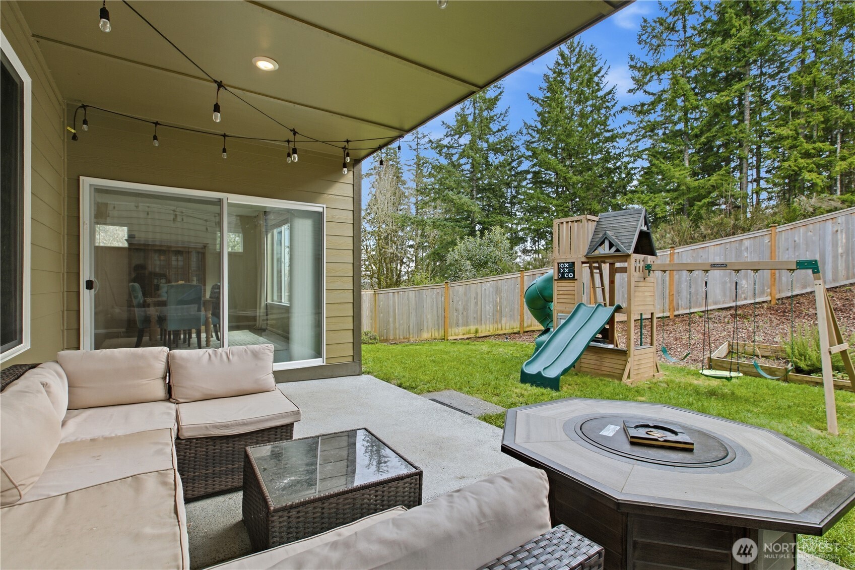 1226 Baker Hts Loop Bremerton, WA 98312 - Photo 35 of 40 a view of a backyard with furniture and a garden