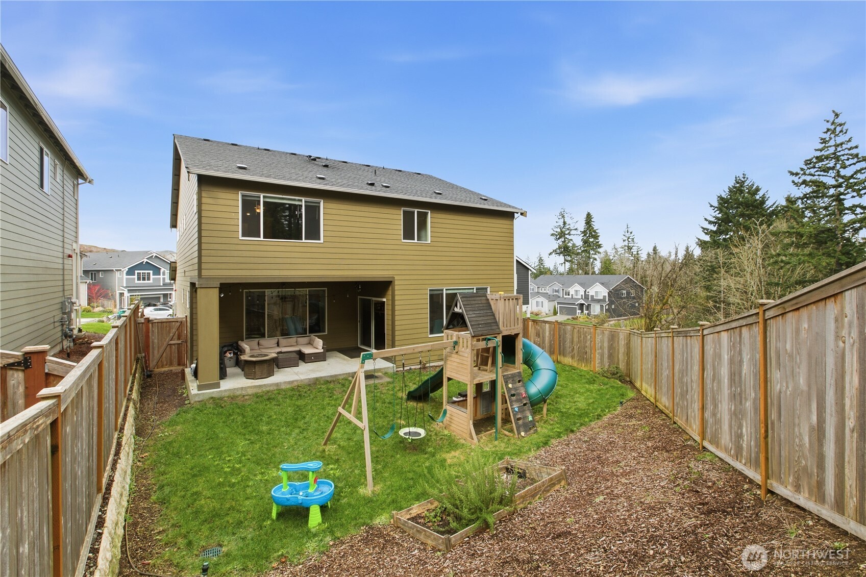 1226 Baker Hts Loop Bremerton, WA 98312 - Photo 37 of 40 a view of a house with backyard and sitting area