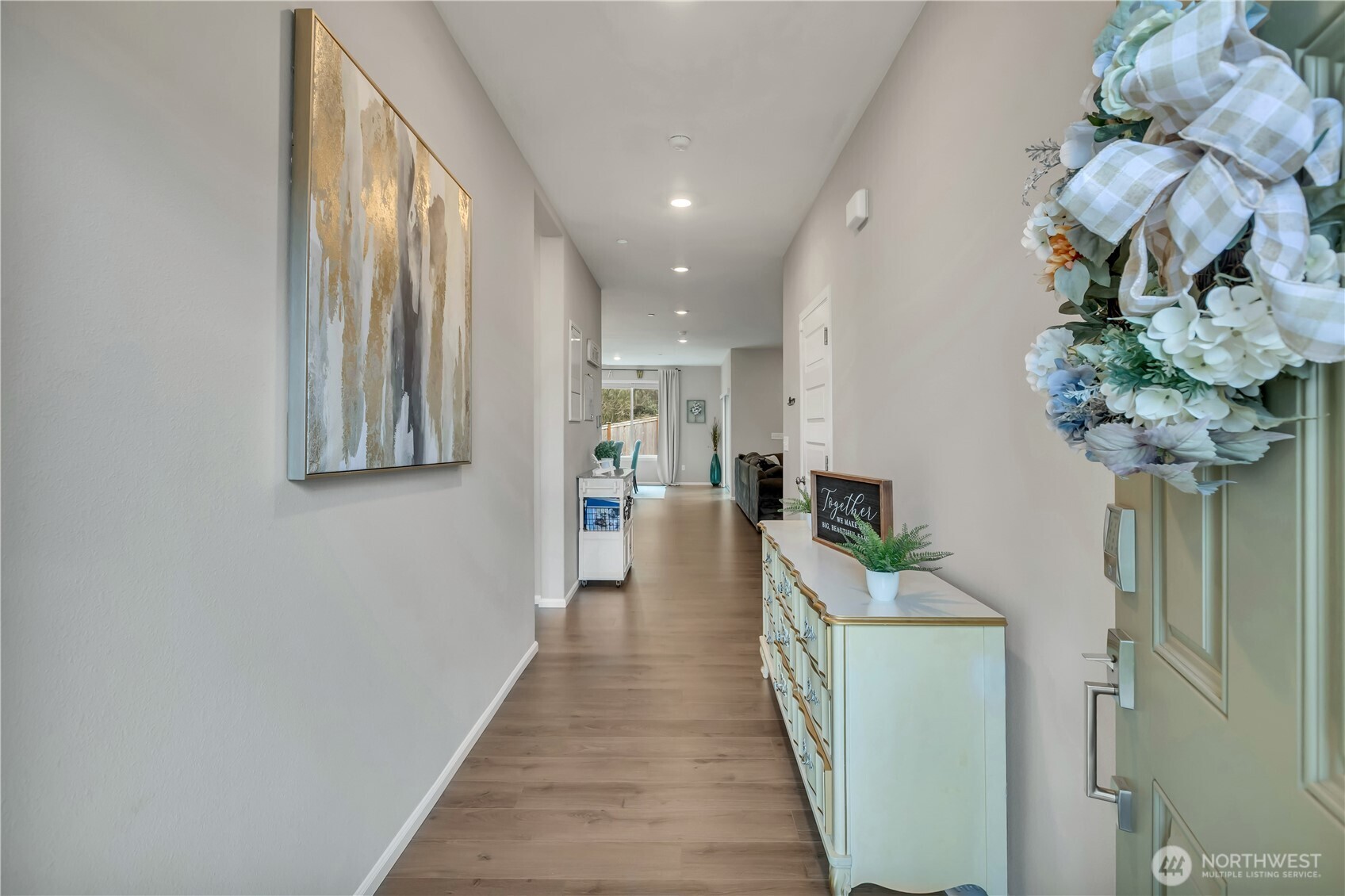 1226 Baker Hts Loop Bremerton, WA 98312 - Photo 4 of 40 a view of a hallway with wooden floor