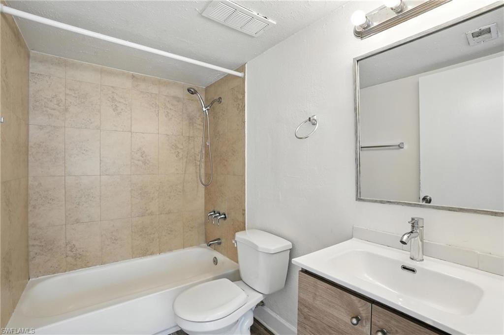 201-5 Santa Clara Drive, Unit 201 Naples, FL 34104 - Photo 12 of 23 a bathroom with a sink toilet and shower