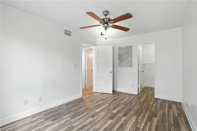 a view of an empty walk in closet