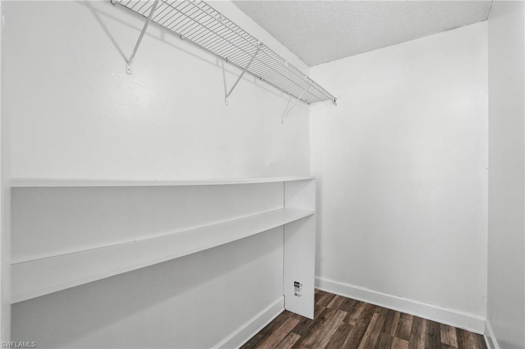 201-5 Santa Clara Drive, Unit 201 Naples, FL 34104 - Photo 21 of 23 a view of an empty walk in closet