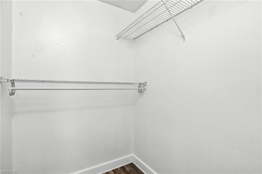 201-5 Santa Clara Drive, Unit 201 Naples, FL 34104 - Photo 10 of 23 a view of small space with racks on the wall