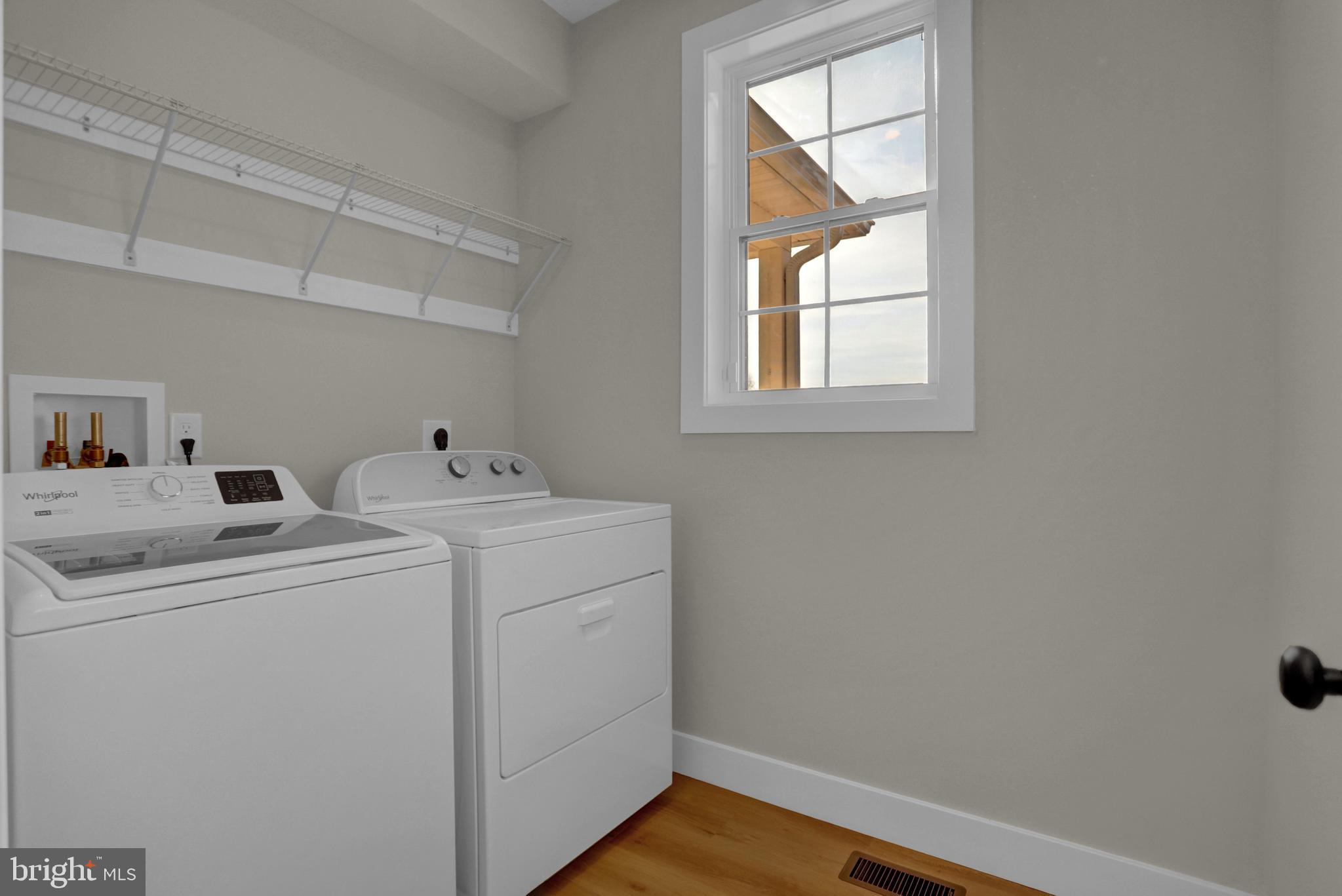 3542 Revolea Beach Road Middle River, MD 21220 - Photo 22 of 28 a utility room with dryer and washer
