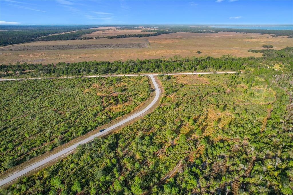 81 Meadow Lark Boulevard Frostproof, FL 33843 - Photo 17 of 19 a view of an ocean and beach