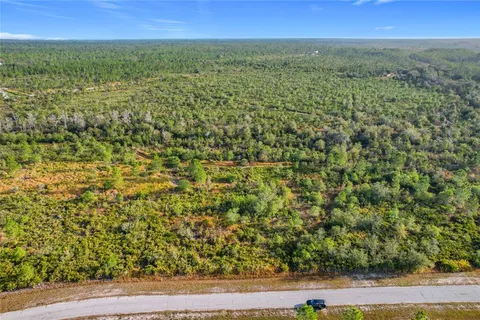 a view of a field with an outdoor space