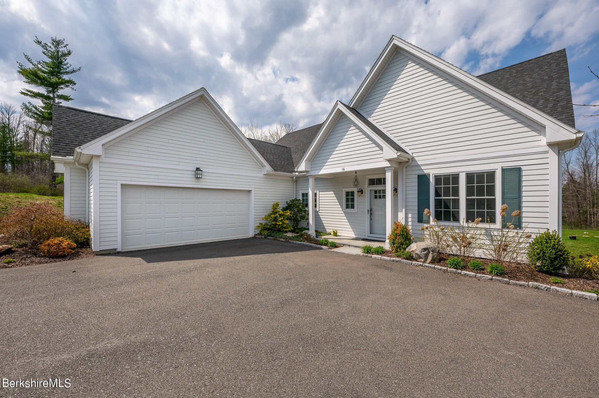 16 Burning Tree Road Great Barrington, MA 01230 - Photo 2 of 39 a view of a house with a yard and garage