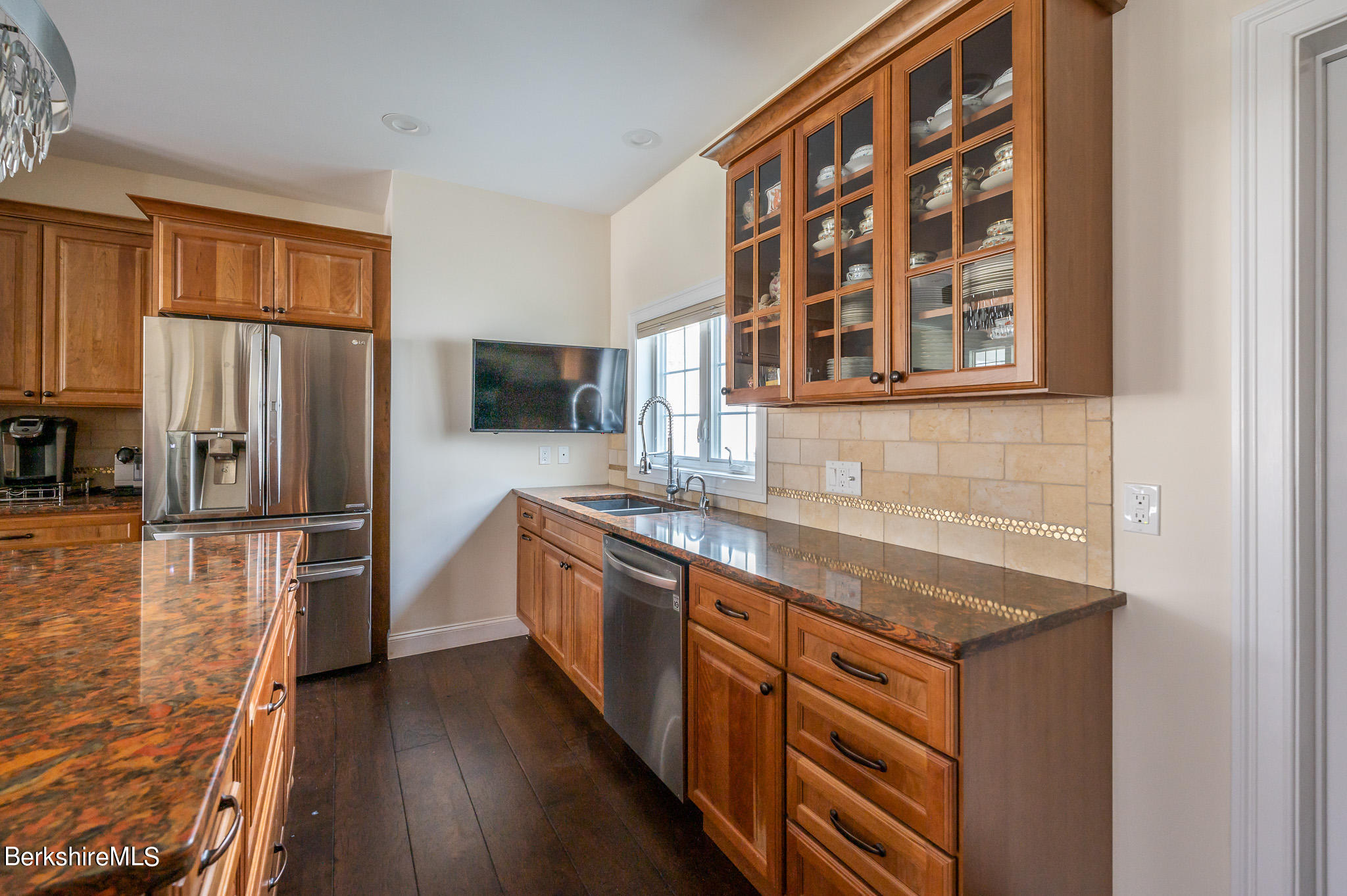 16 Burning Tree Road Great Barrington, MA 01230 - Photo 11 of 39 a kitchen with stainless steel appliances granite countertop a stove and a refrigerator