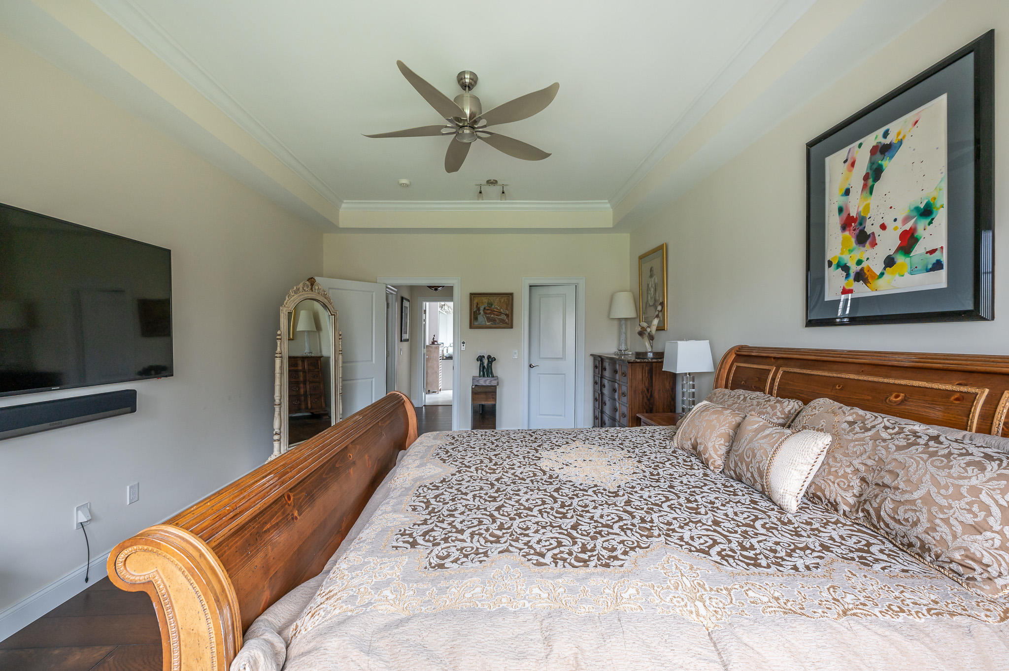 16 Burning Tree Road Great Barrington, MA 01230 - Photo 17 of 39 a bedroom with a bed and a flat screen tv