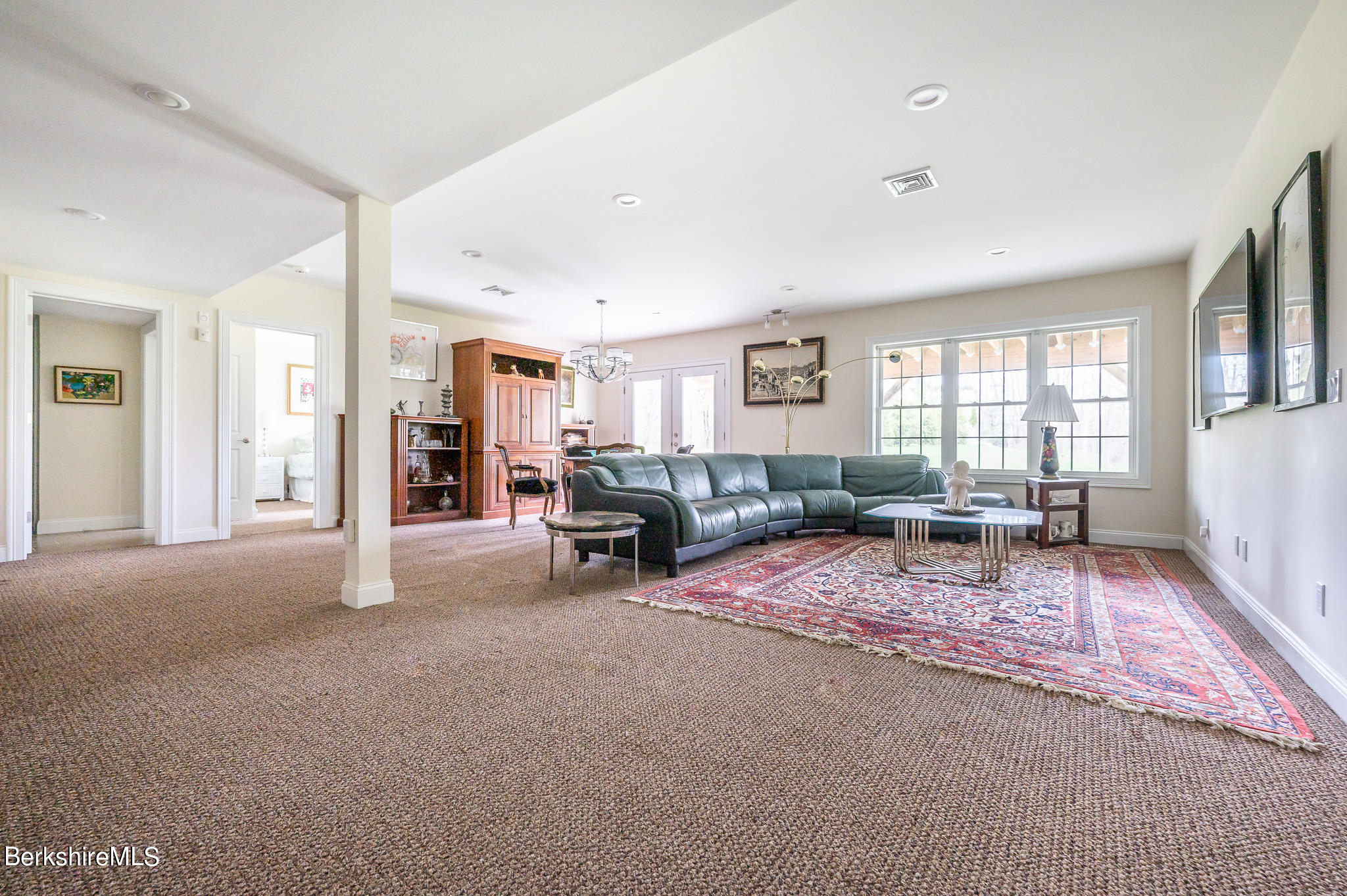 16 Burning Tree Road Great Barrington, MA 01230 - Photo 23 of 39 a living room with furniture and a large window