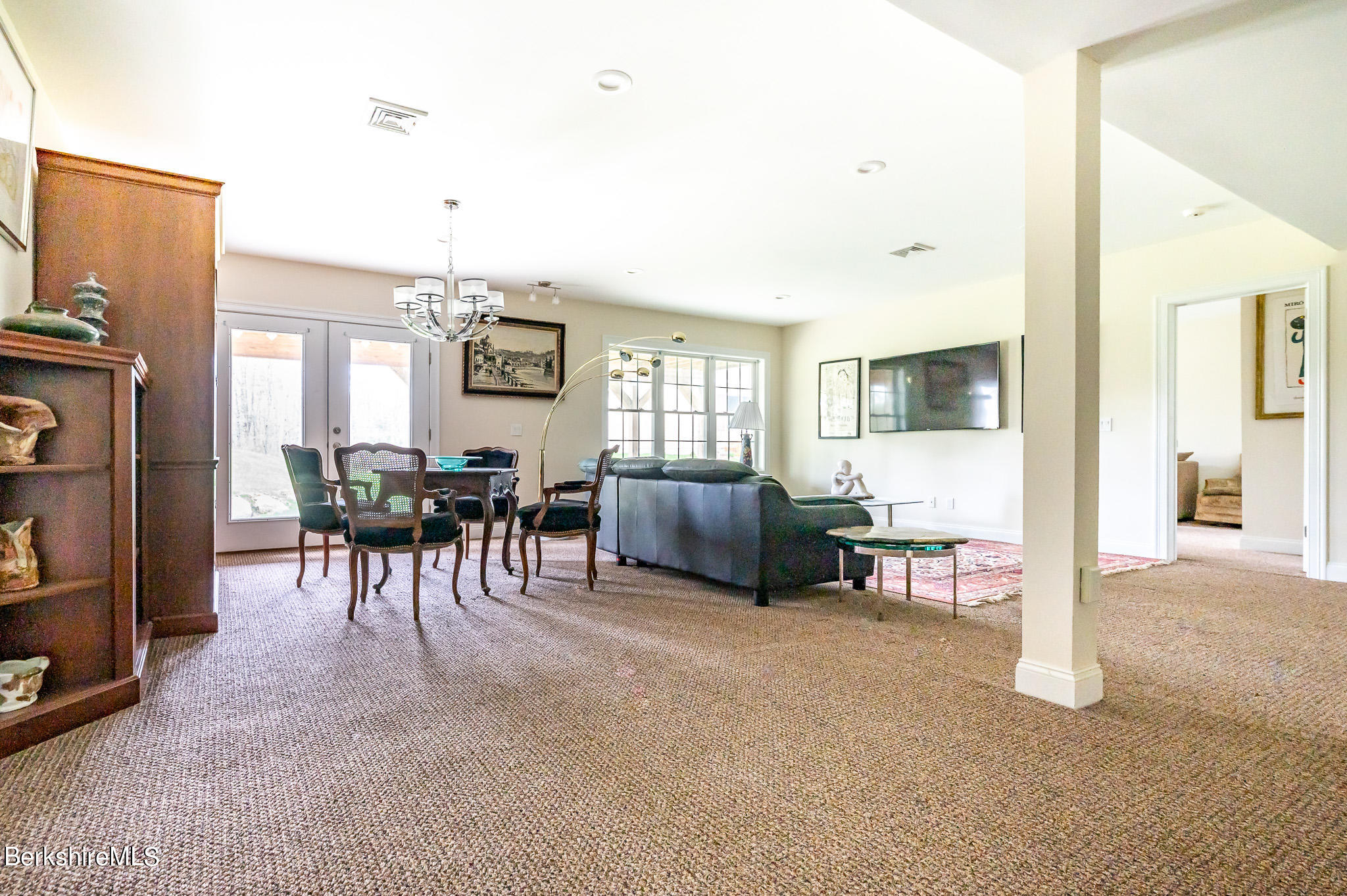 16 Burning Tree Road Great Barrington, MA 01230 - Photo 24 of 39 a living room with furniture and a flat screen tv