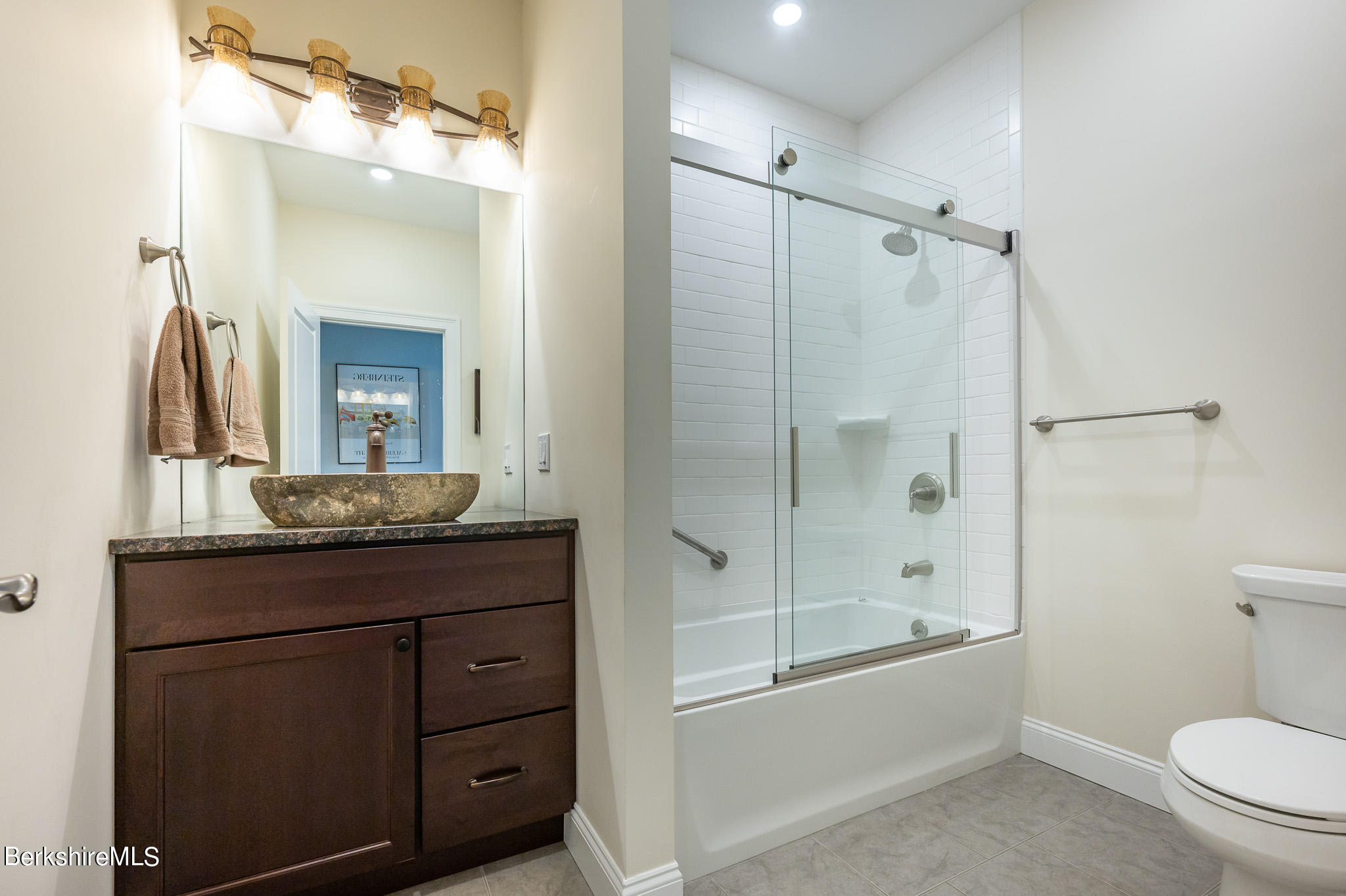 16 Burning Tree Road Great Barrington, MA 01230 - Photo 28 of 39 a bathroom with a granite countertop sink a toilet and shower