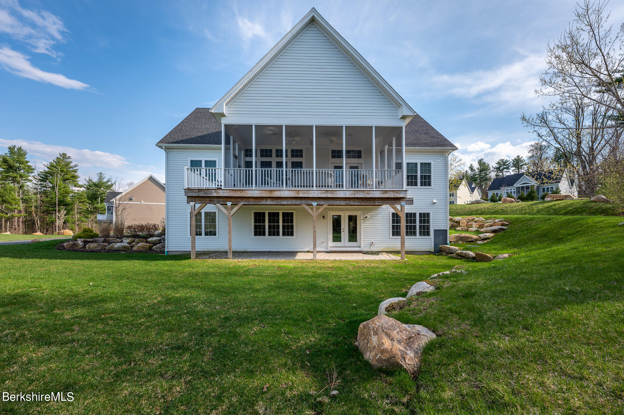 16 Burning Tree Road Great Barrington, MA 01230 - Photo 36 of 39 a front view of a house with a yard and trees