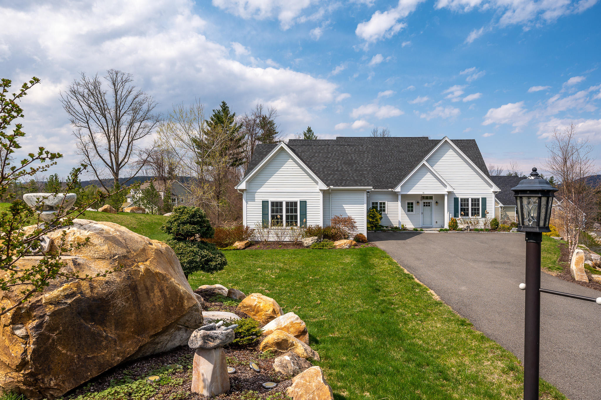 16 Burning Tree Road Great Barrington, MA 01230 - Photo 37 of 39 a front view of a house with garden