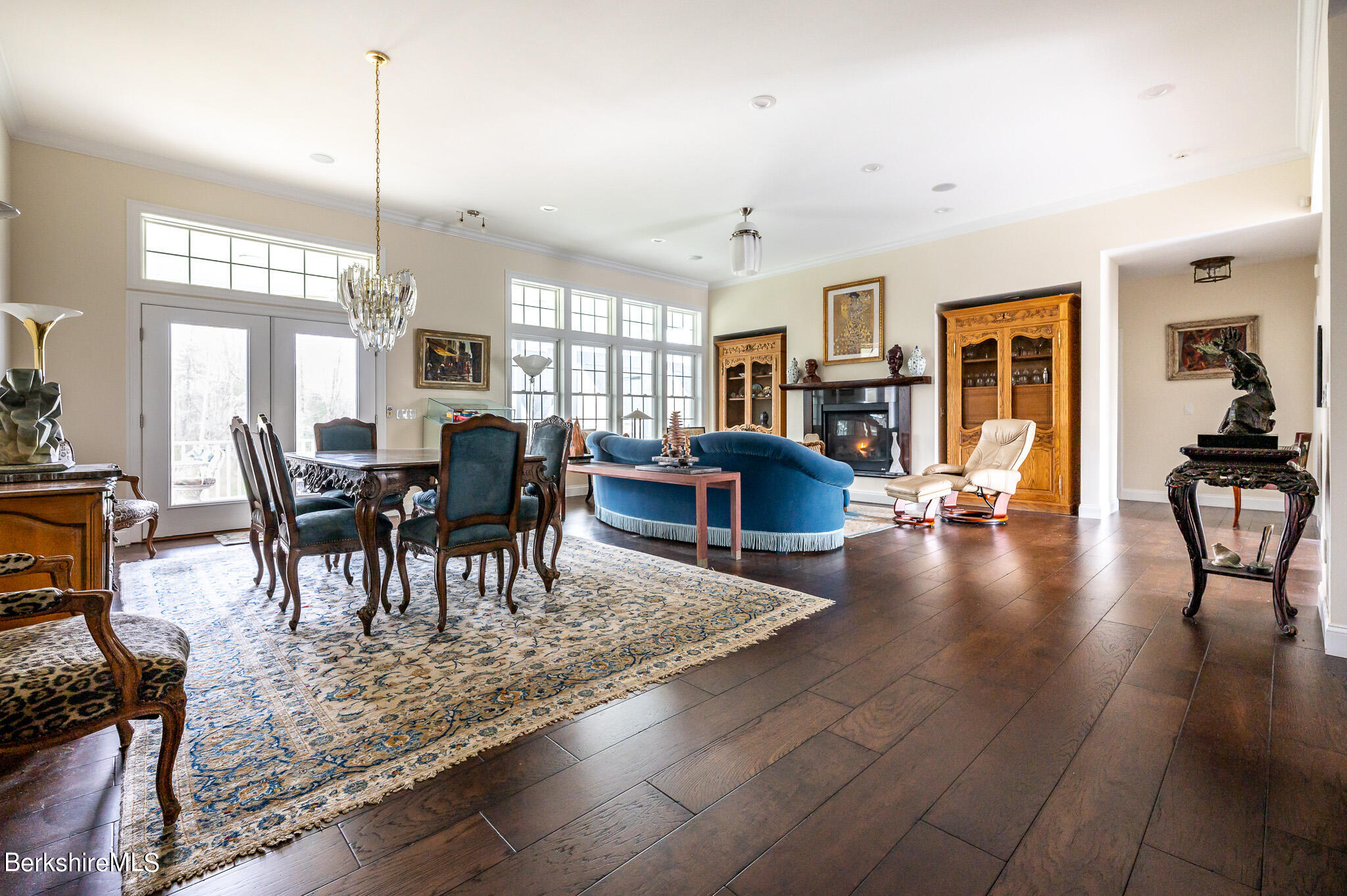 16 Burning Tree Road Great Barrington, MA 01230 - Photo 7 of 39 a view of a dining room and livingroom with furniture wooden floor a chandelier
