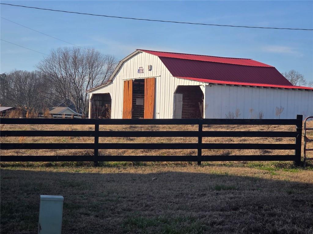 5465 Jot Em Down Road Cumming, GA 30041 - Photo 2 of 11 a view of a small house with a yard