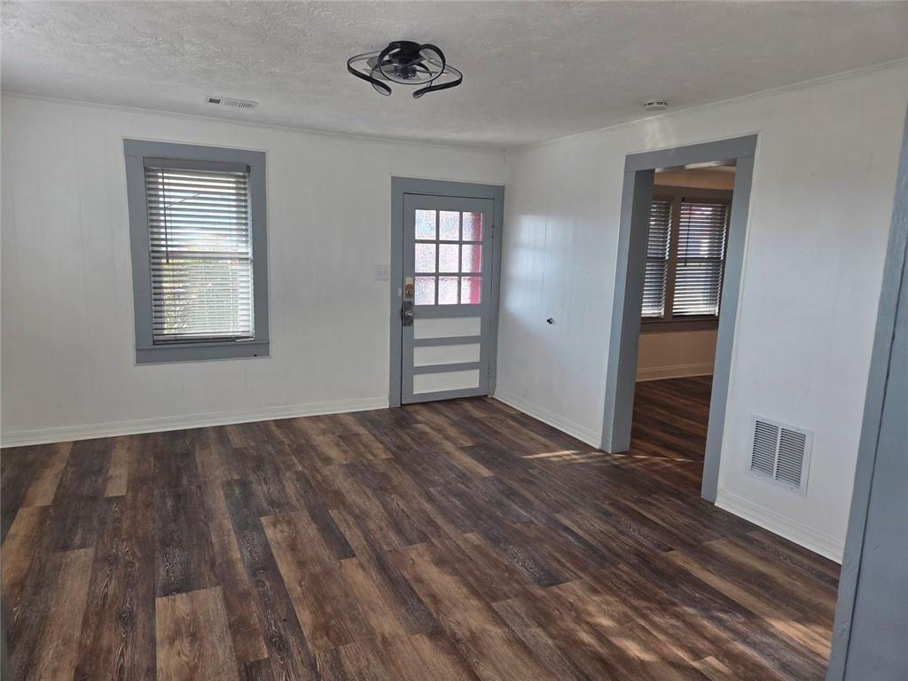 5465 Jot Em Down Road Cumming, GA 30041 - Photo 6 of 11 wooden floor in an empty room with a window