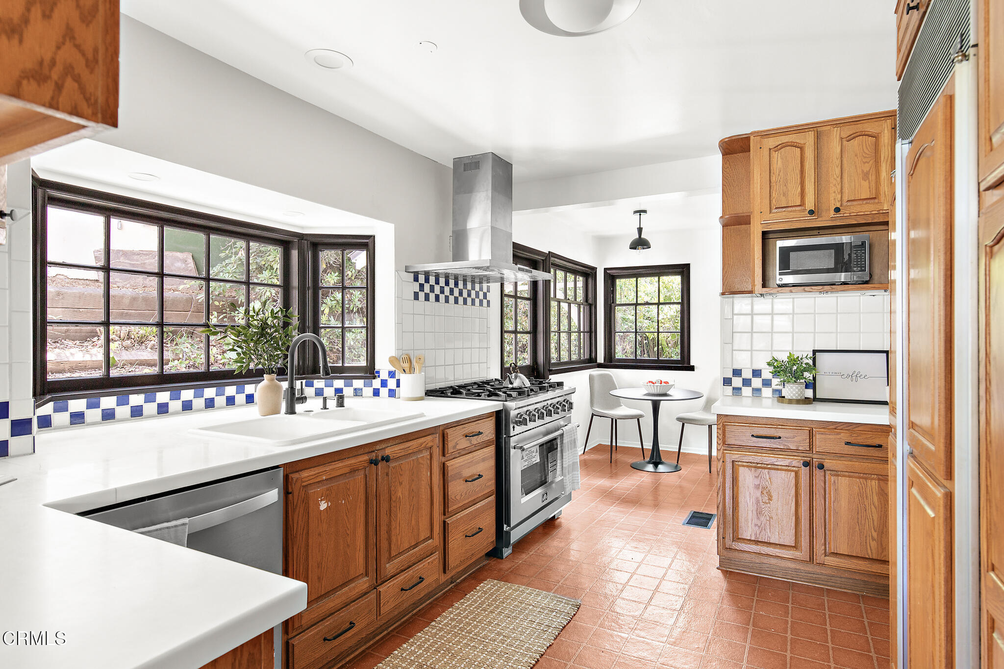 1858 Laurel Bay Drive Pasadena, CA 91105 - Photo 12 of 47 a kitchen with kitchen island granite countertop a sink and cabinets