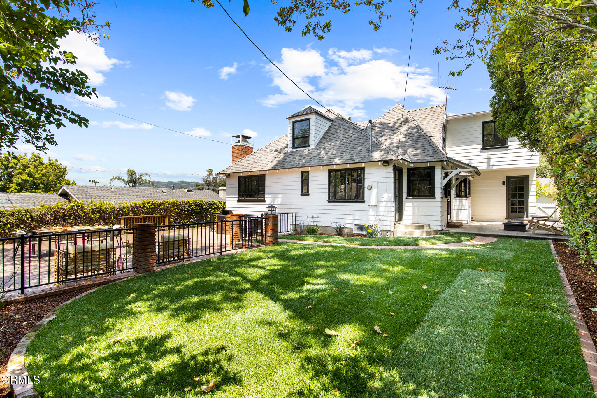 1858 Laurel Bay Drive Pasadena, CA 91105 - Photo 36 of 47 a front view of a house with a yard table and chairs