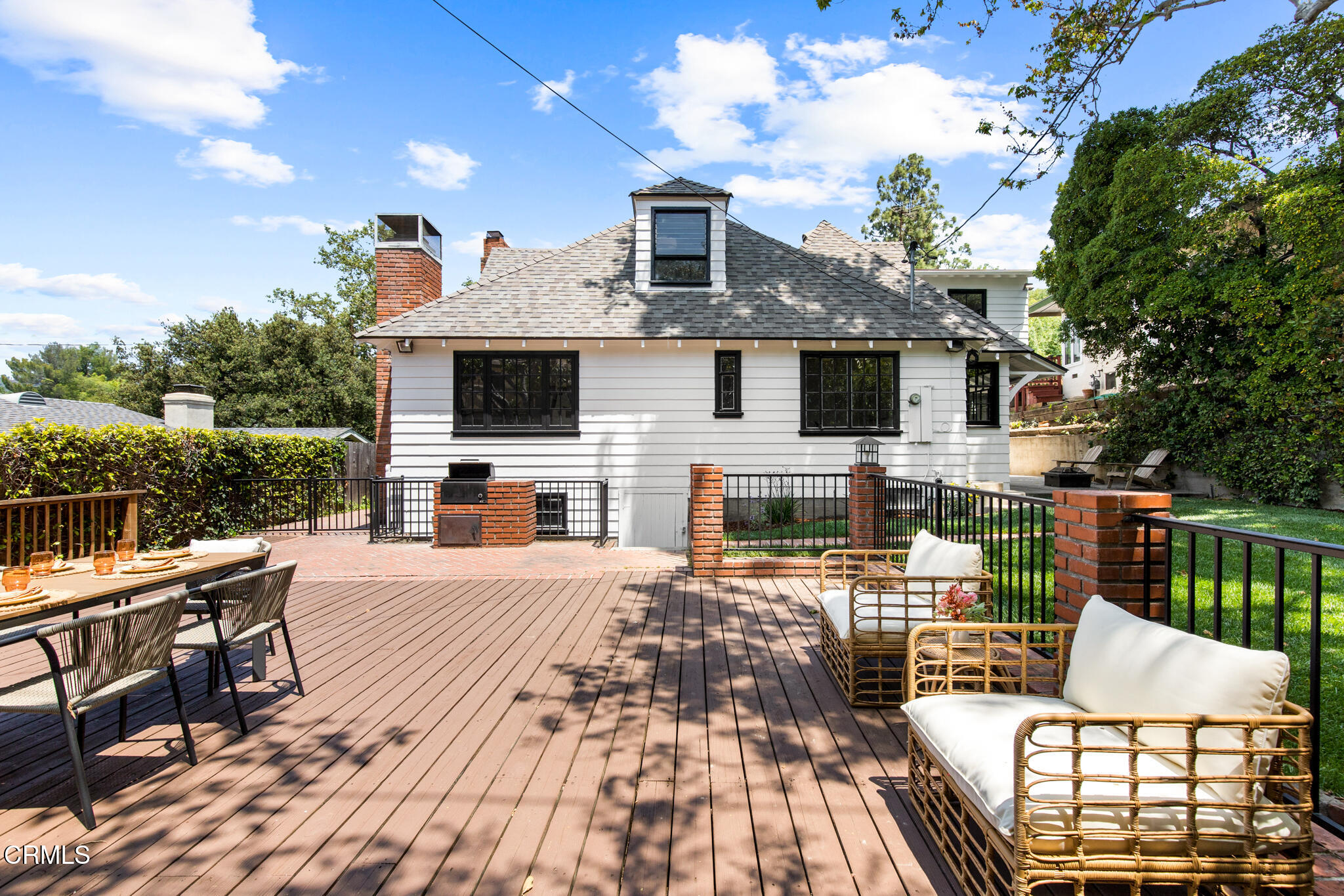 1858 Laurel Bay Drive Pasadena, CA 91105 - Photo 39 of 47 a view of a patio with couches table and chairs with wooden floor and fence