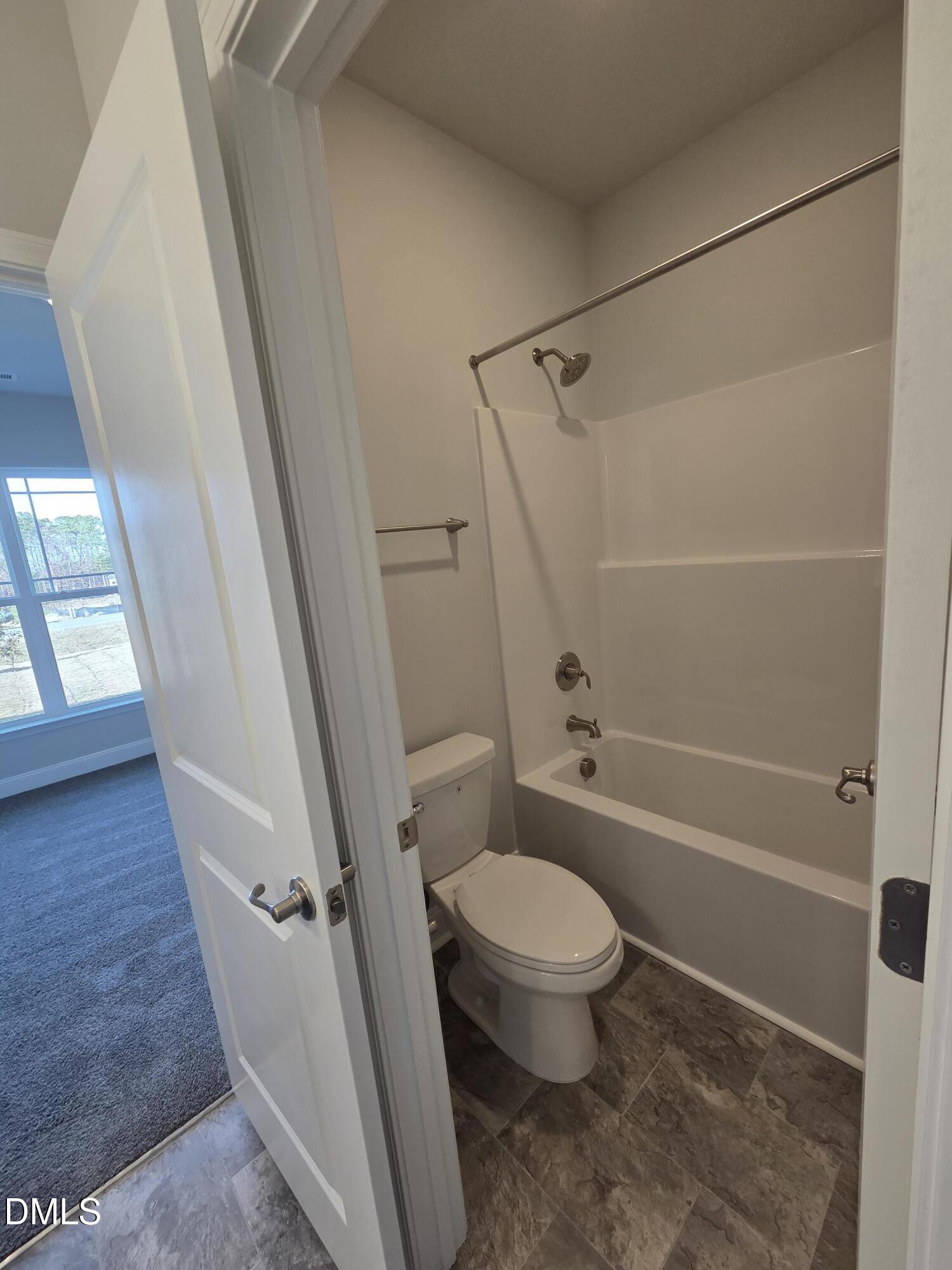 4979 Trident Maple Court Battleboro, NC 27809 - Photo 37 of 41 a bathroom with a toilet and a shower