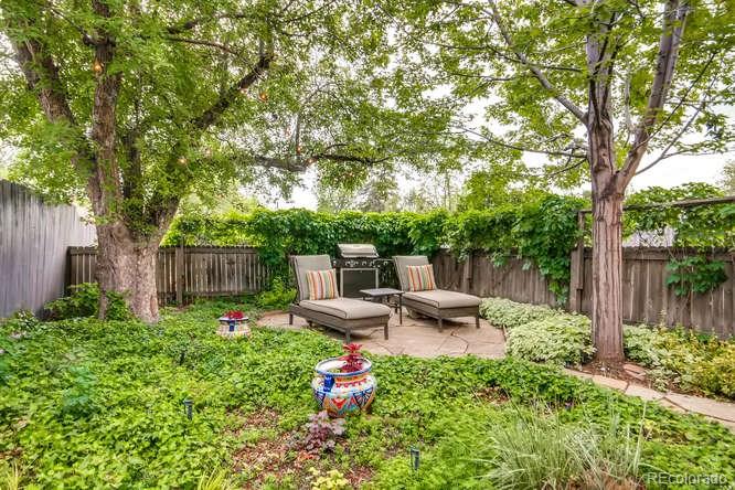 2917 Chase Street Wheat Ridge, CO 80214 - Photo 20 of 26 a view of a backyard with plants and a patio