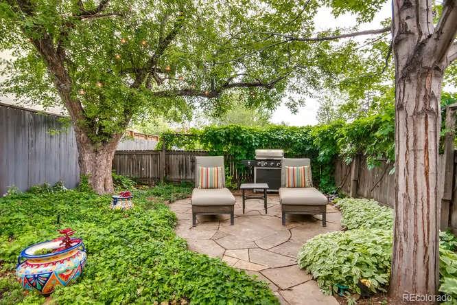 2917 Chase Street Wheat Ridge, CO 80214 - Photo 21 of 26 a view of backyard with seating space and trees