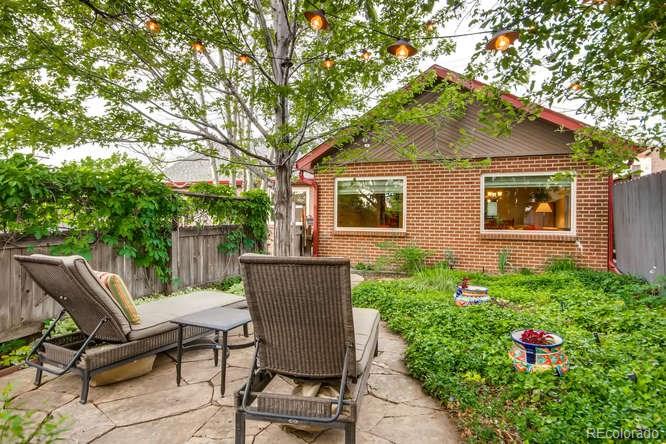 2917 Chase Street Wheat Ridge, CO 80214 - Photo 22 of 26 a view of backyard with seating space and wooden fence