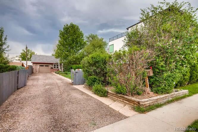 2917 Chase Street Wheat Ridge, CO 80214 - Photo 26 of 26 a view of a yard with potted plants