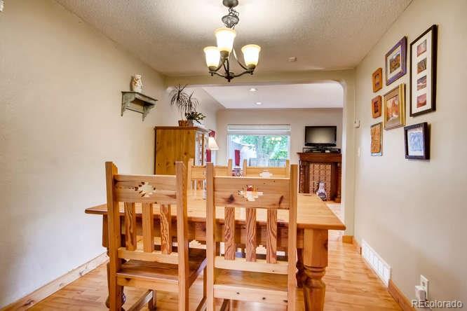 2917 Chase Street Wheat Ridge, CO 80214 - Photo 6 of 26 a view of a dining room with furniture