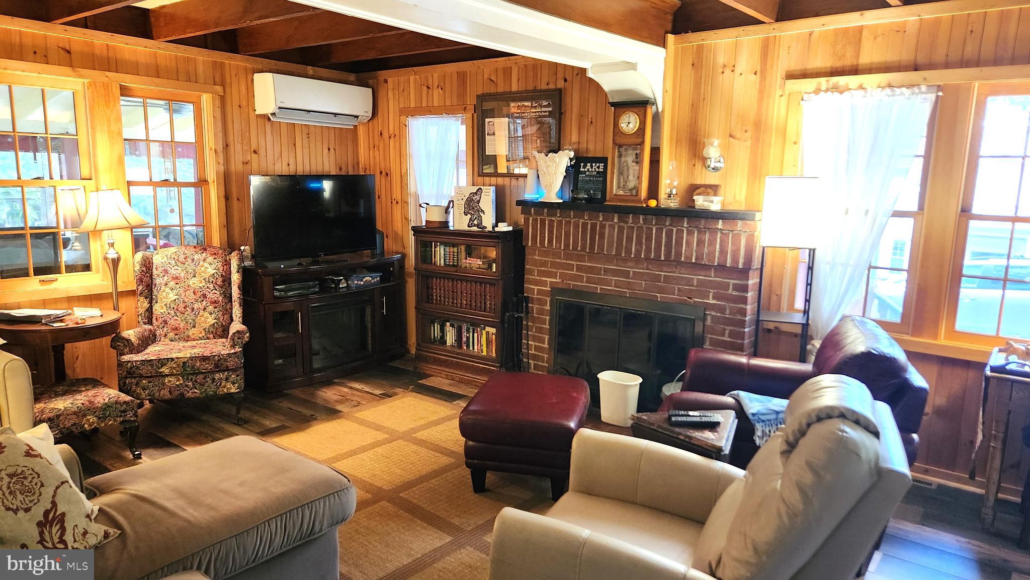 403 Boehm Avenue Mount Gretna, PA 17064 - Photo 11 of 14 a living room with furniture a flat screen tv and a fireplace